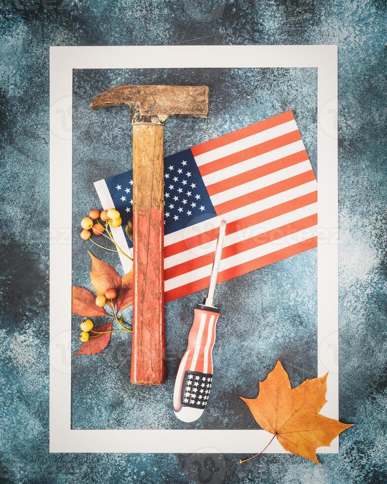 labor day banner with american flag, hammer, screwdriver and autumn leaves photo