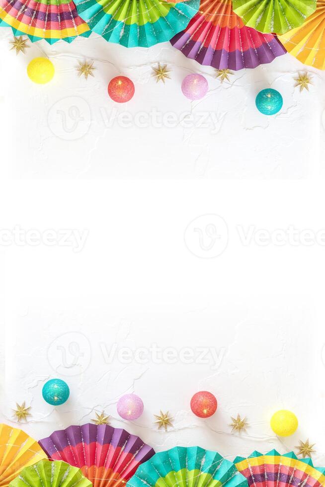 Colorful paper fans, lightening and stars on a white background with place for text photo