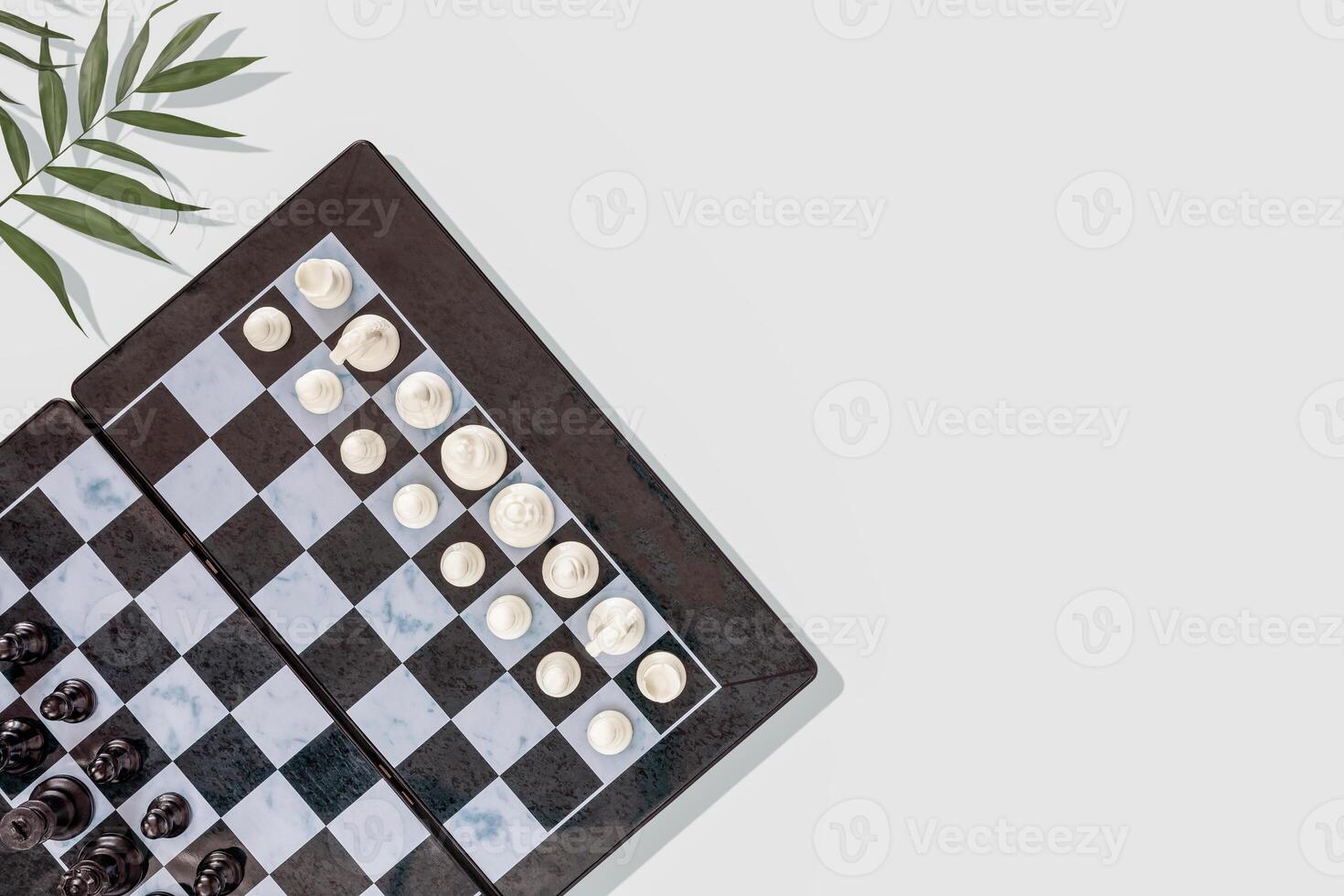 Chess composition with a chess board with placed pieces and palm leaves on a blue background photo