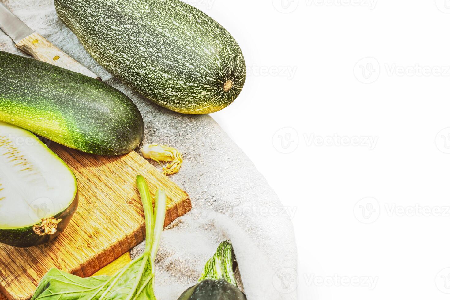 Local grown, green zucchini on a white background with place for text photo