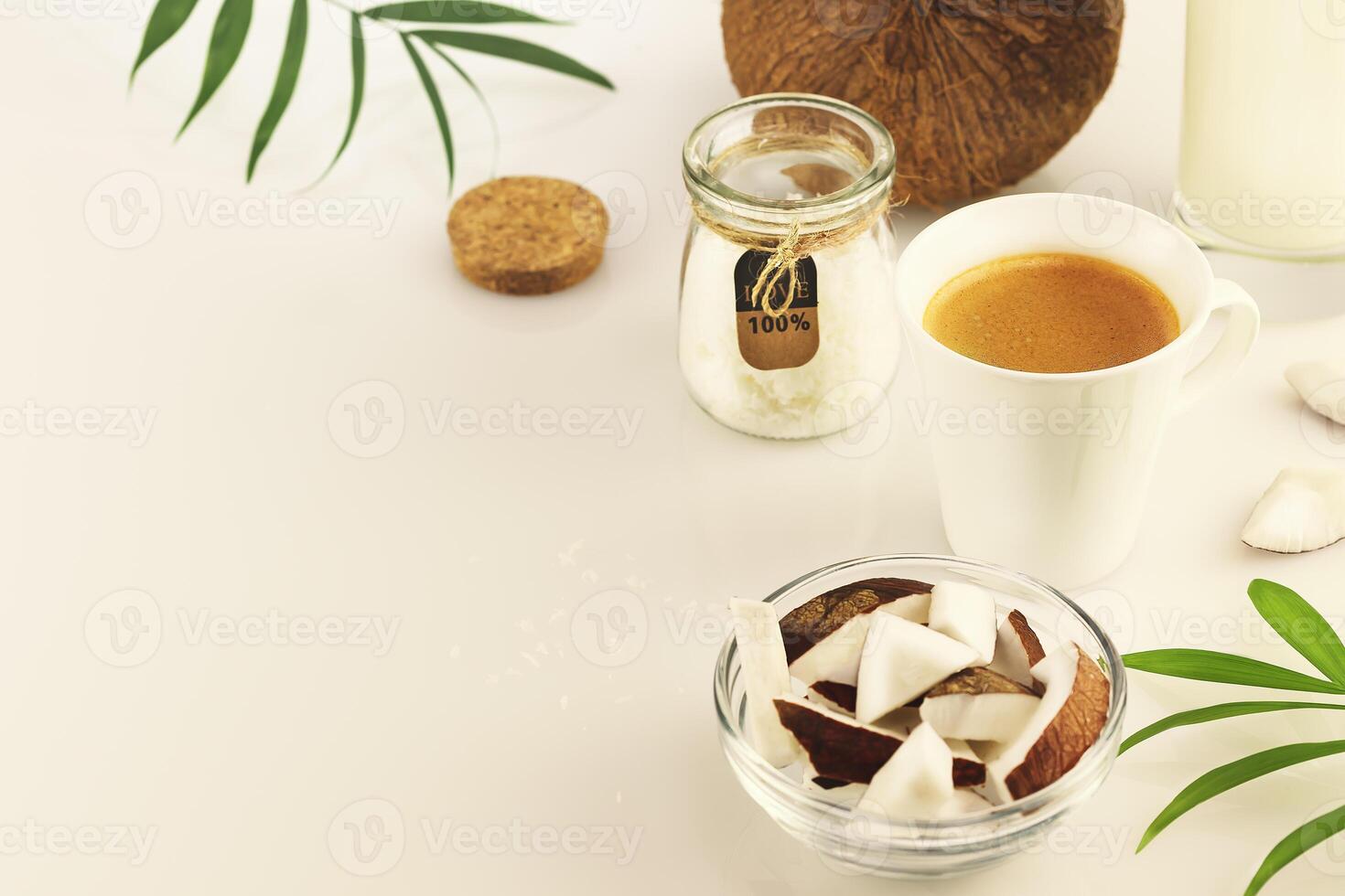 Food composition with cup of espresso and coconut products photo