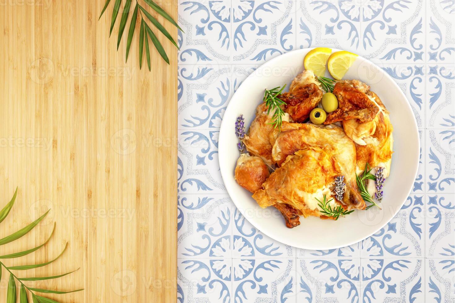 Grilled chicken with vegetables on a kitchen table photo
