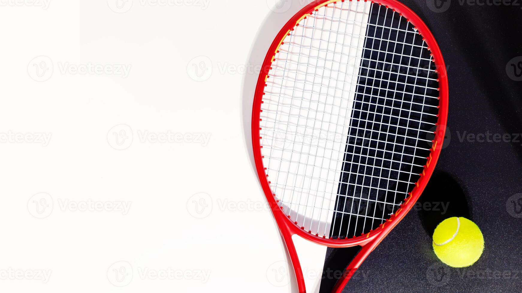 Tennis racket and a ball on a black and white background photo