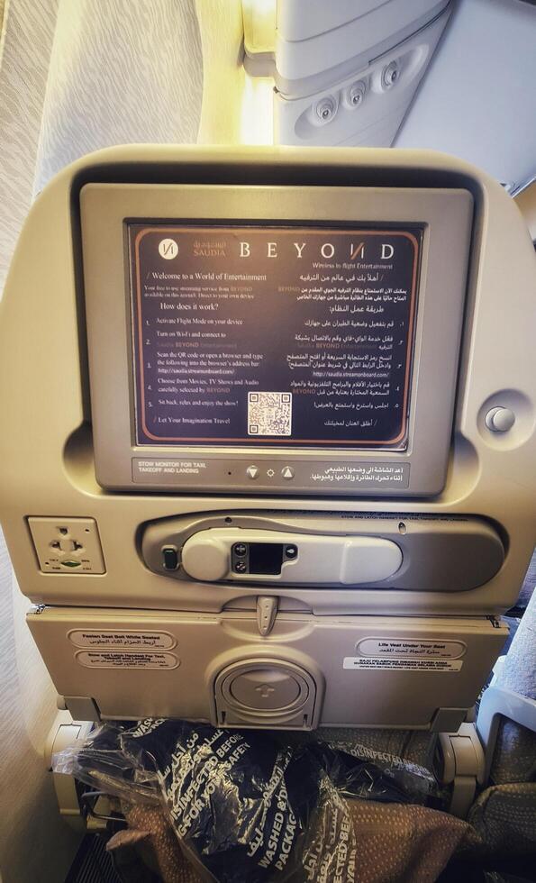 Medina, Saudi Arabia on March 3, 2024. Umrah pilgrims board a Saudi Arabia Airlines plane photo