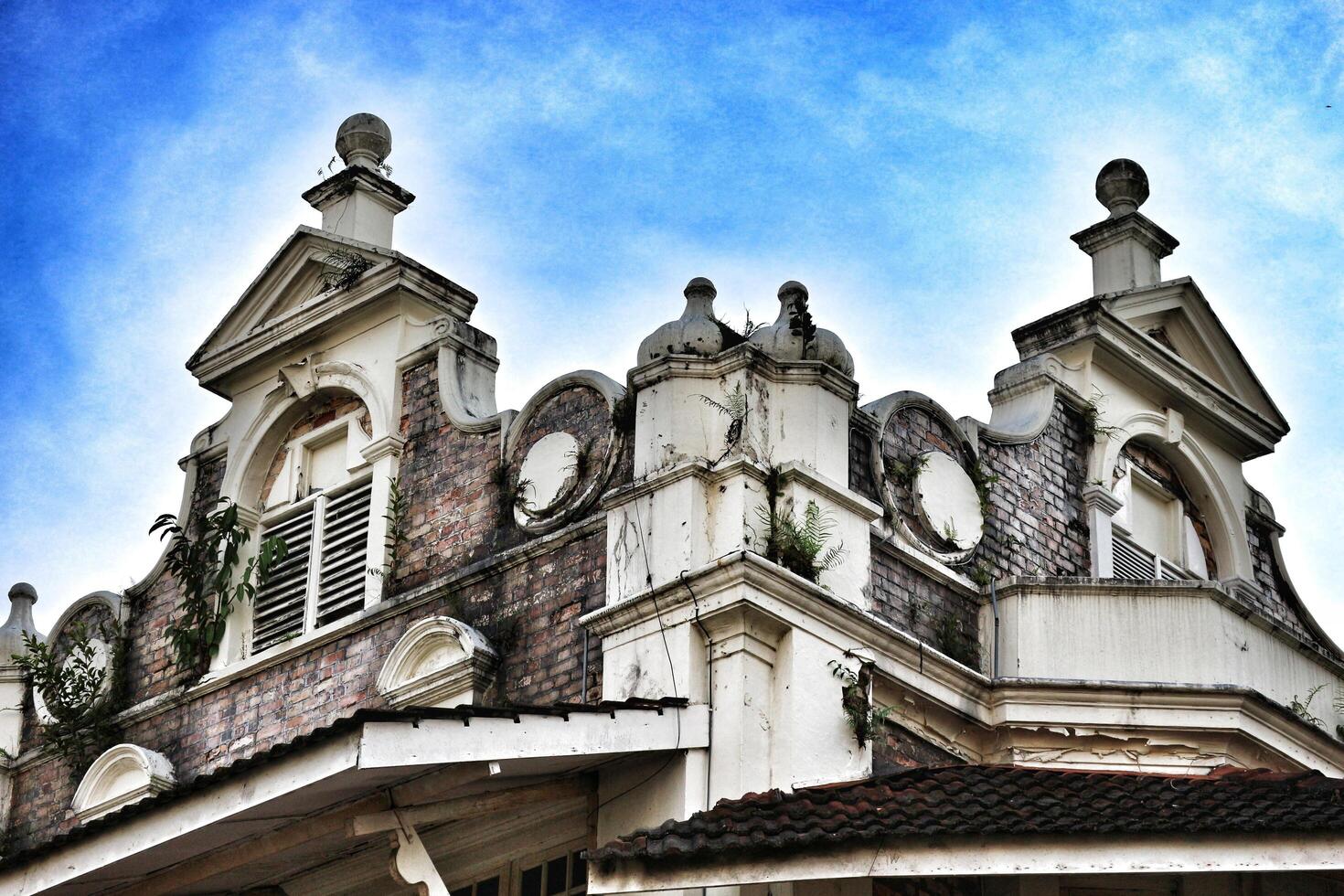 Kuala Lumpur, Malaysia on May 21, 2023. The top of the building and roof of the former chartered bank building photo