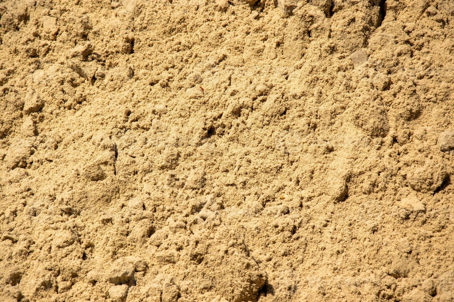 A close-up image of fine sand, showcasing its texture and color photo