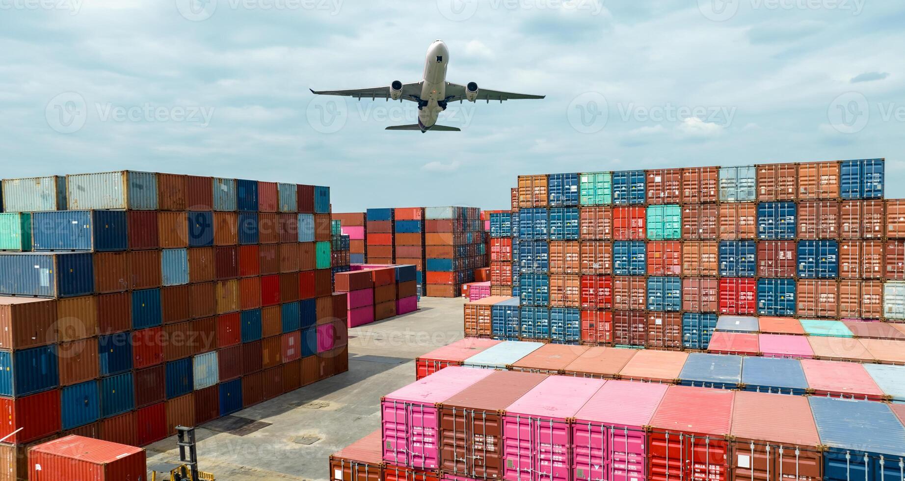 Airplane flying above container logistic. Container crisis. Freight transportation. Logistic industry. Container ship for export logistics. Container at the harbor for truck transport. Air transport. photo