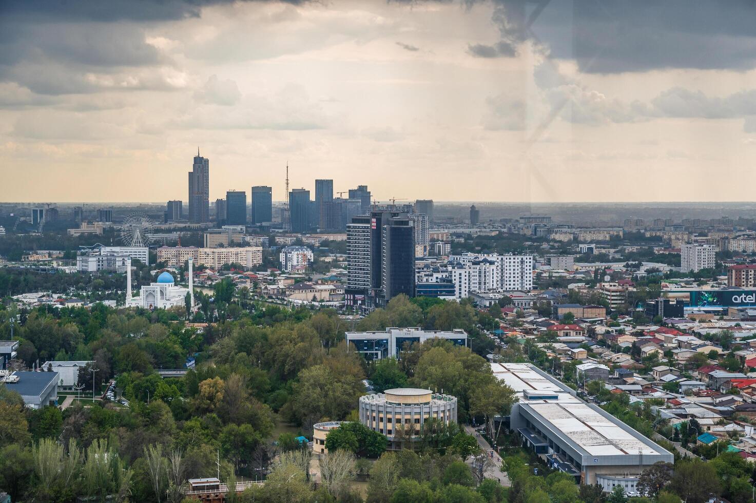 aerial view above drone of city Tashkent and skyscrapers from observation deck in TV tower. Tashkent, Uzbekistan - April 16, 2024 photo