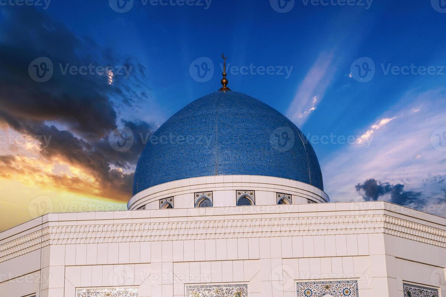 blue dome of modern white Masjid Minor Mosque in Tashkent in Uzbekistan on background of beautiful sky photo