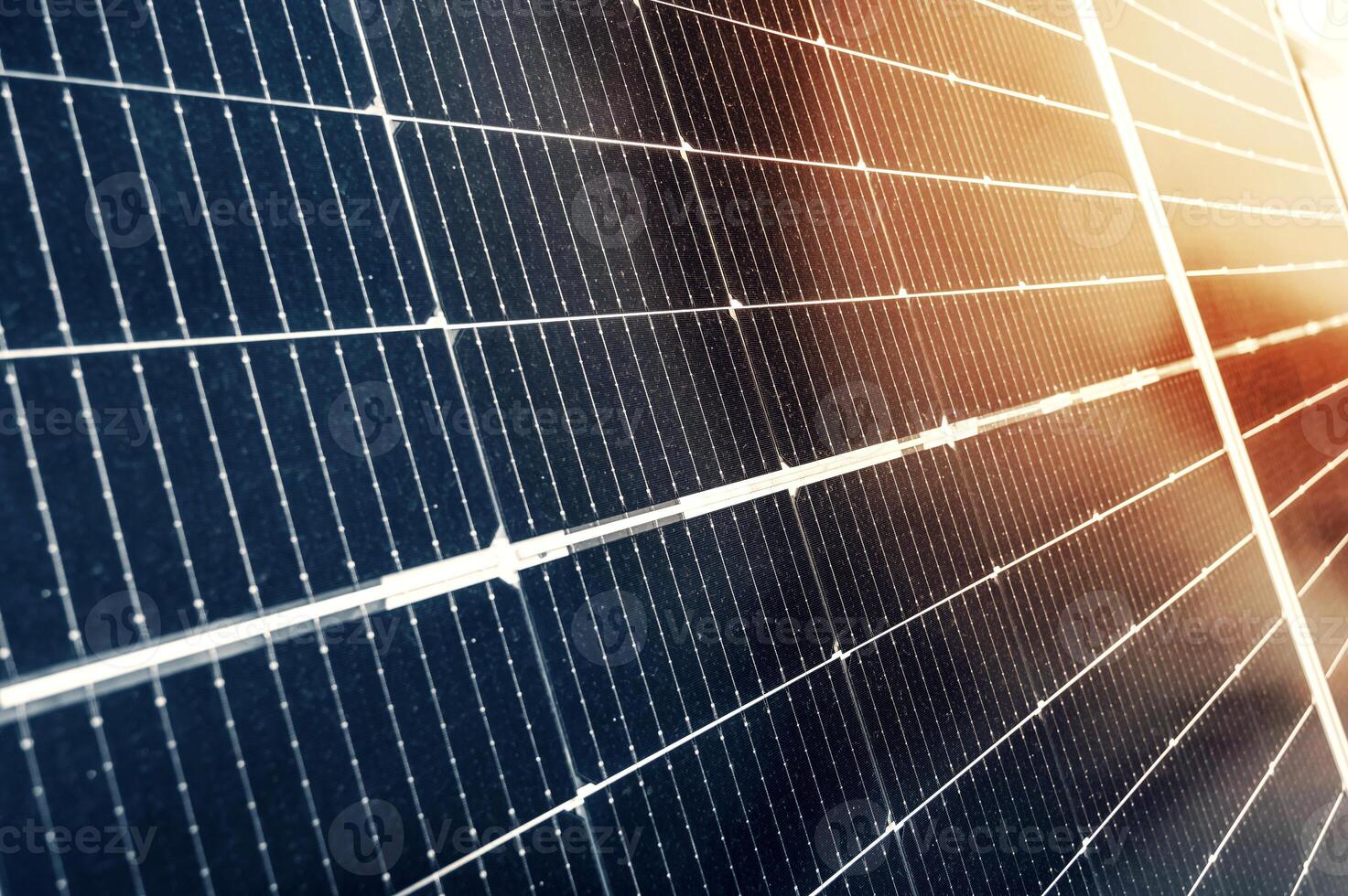 cells of modern blue solar panel in sun close-up. Green renewable energy photo