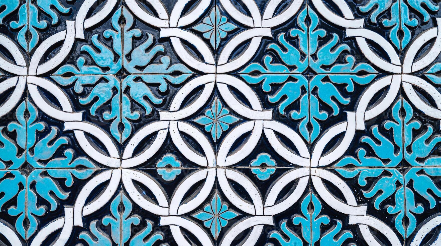 tile mosaic with traditional oriental Arabic Uzbek pattern decorated with blue and white floral ornament photo