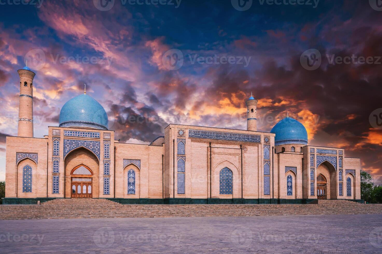 ancient medieval Muslim Islamic mosque Hazrati Imam in Tashkent in Uzbekistan on background of a sunset sky photo