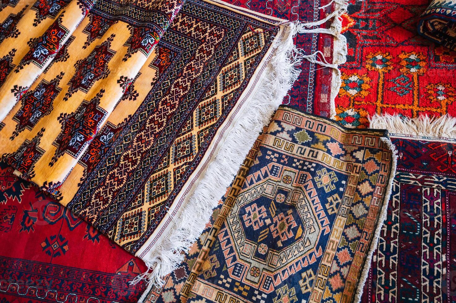 traditional oriental Arab Turkish handmade colorful carpets at bazaar in Turkey in Istanbul photo