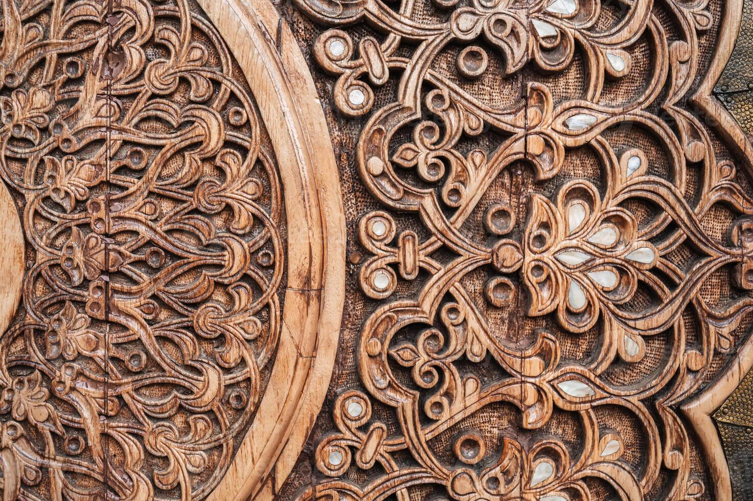 oriental pattern Uzbek traditional ornament on wooden carved door in Tashkent in Uzbekistan photo