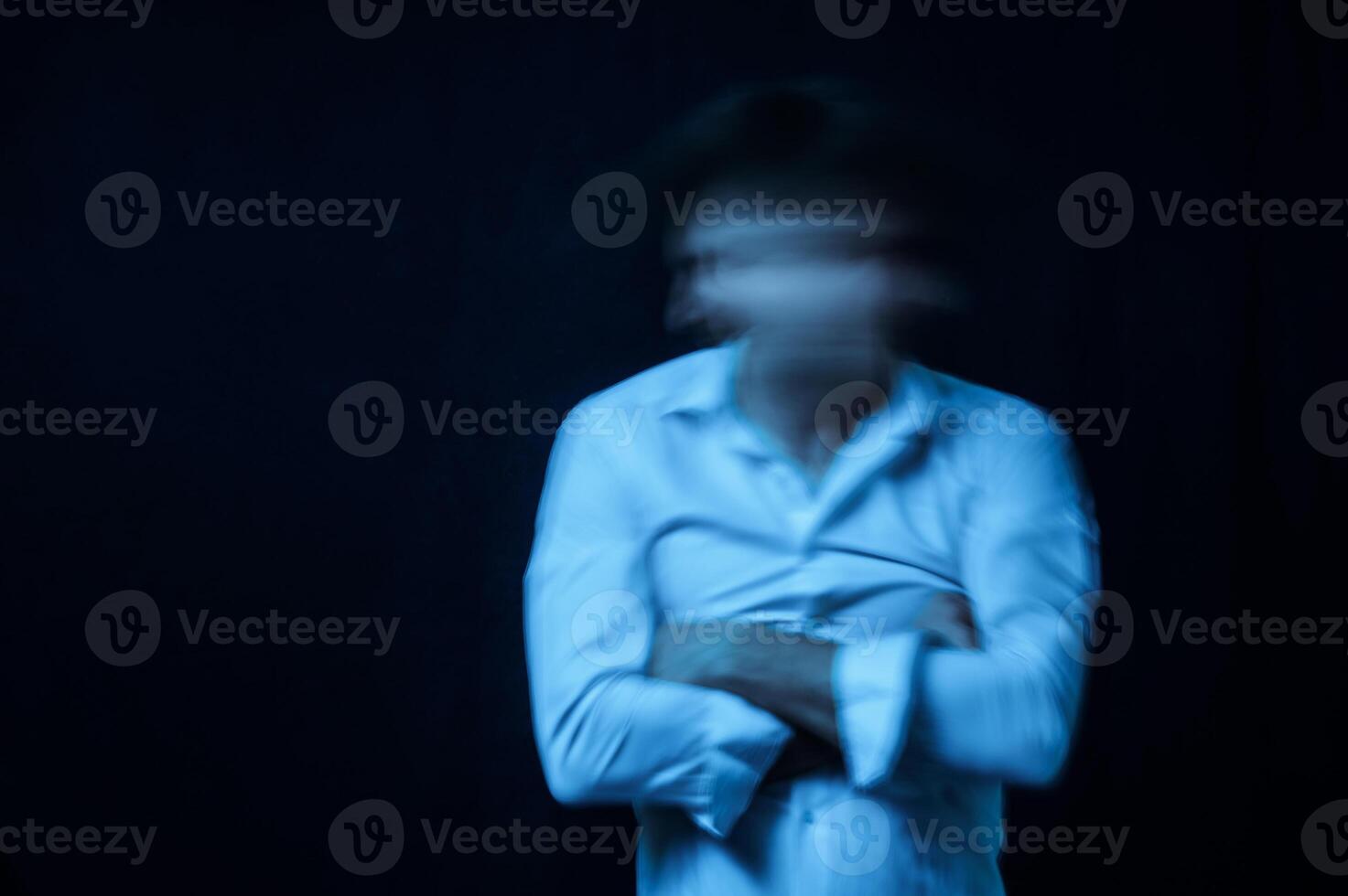 schizophrenic portrait of a man with mental disorders and mental illnesses in a straitjacket photo