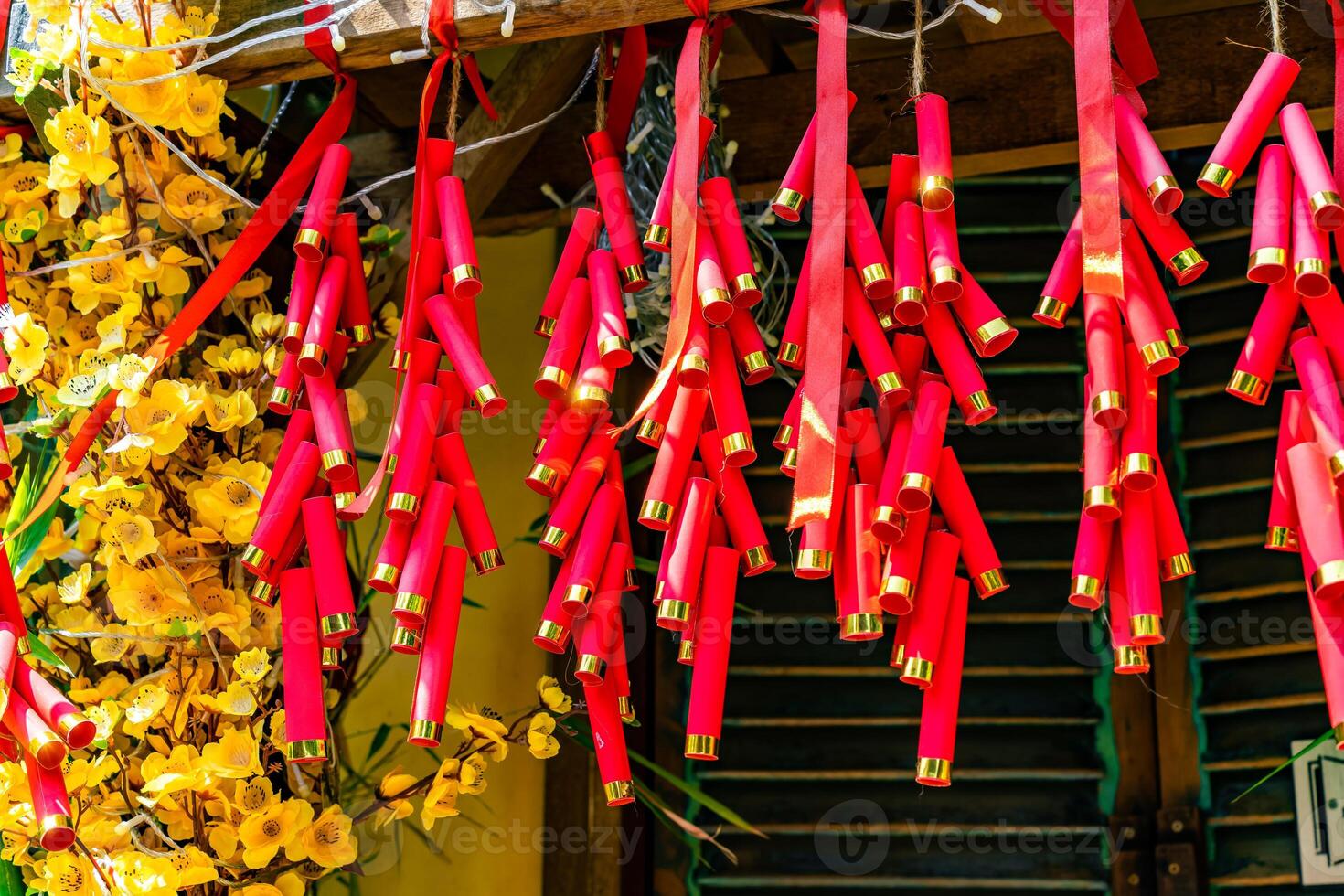 Chinese New Year Decoration--Firecrackers with a blurry background.Character on background symbolizes good luck. photo