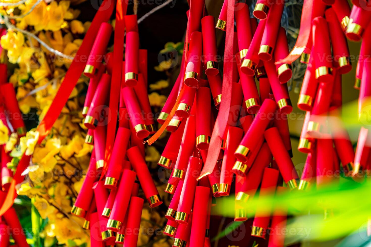 Chinese New Year Decoration--Firecrackers with a blurry background.Character on background symbolizes good luck. photo