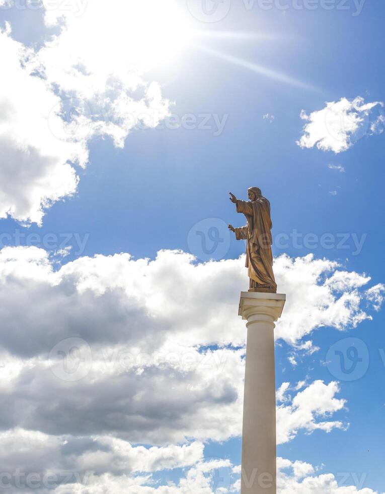 Monument to the Jesus with the blue sky on the background. Religion photo