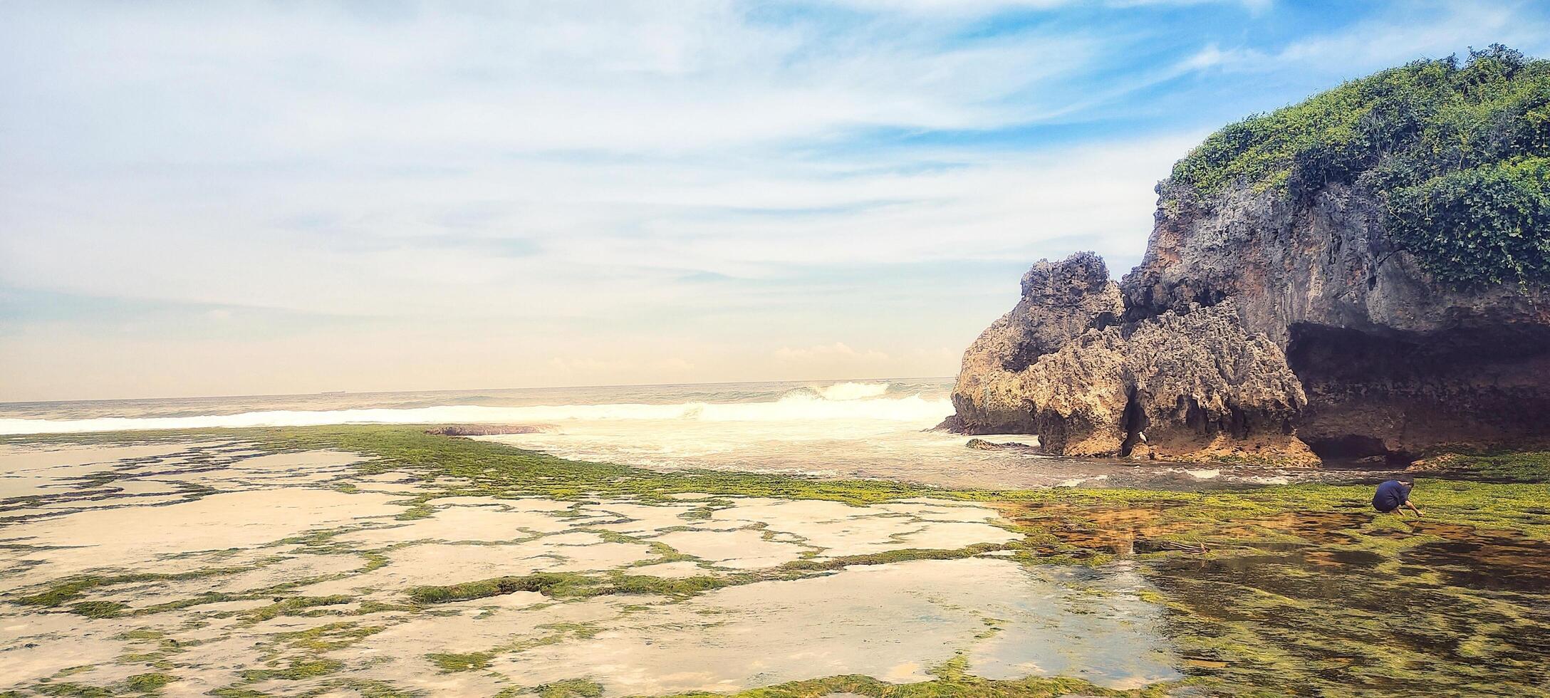 The morning sun shines on the beach on the Indonesian island. Looking for beautiful marine nature to enjoy outdoor summer holidays. photo