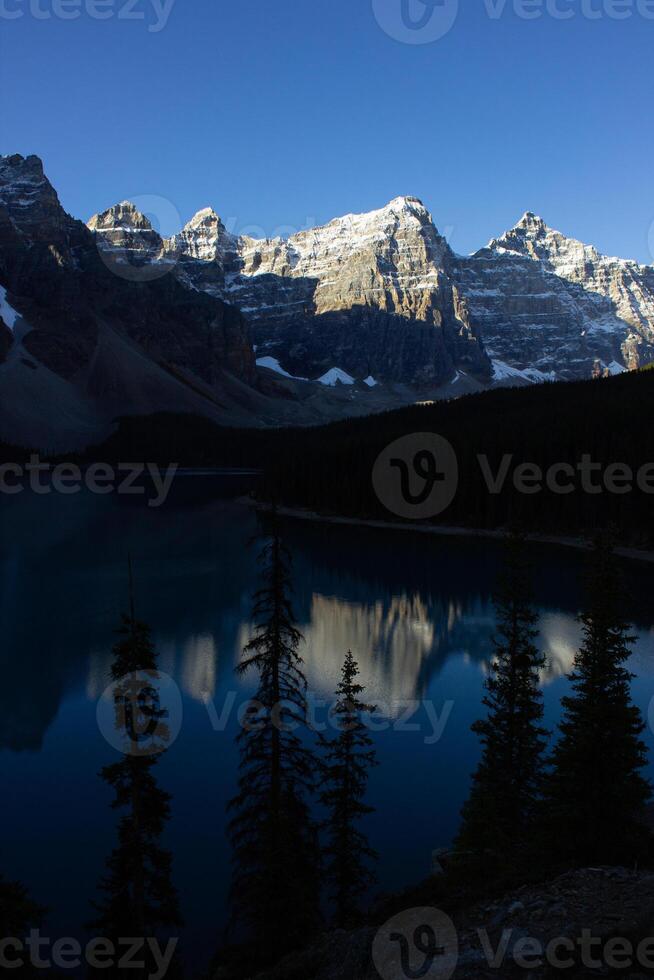 Valley of Ten Peaks near Moraine Lake on a sunny autumn day with snow on the mountain. photo
