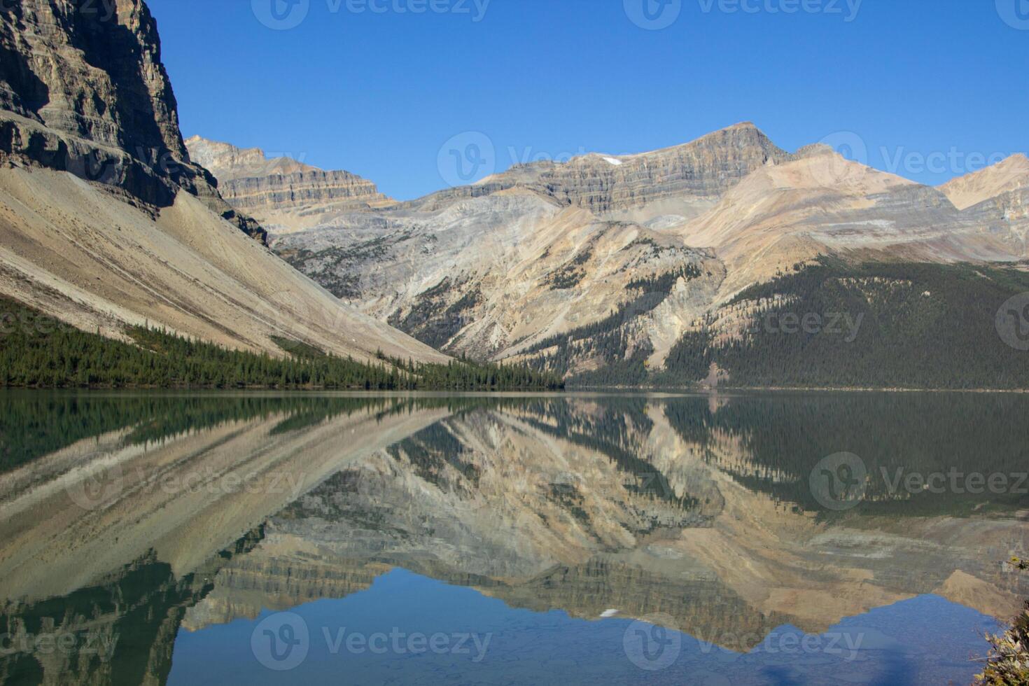 Aerial view of Bow Lake and the reflection of Mount Jimmy Simpson photo