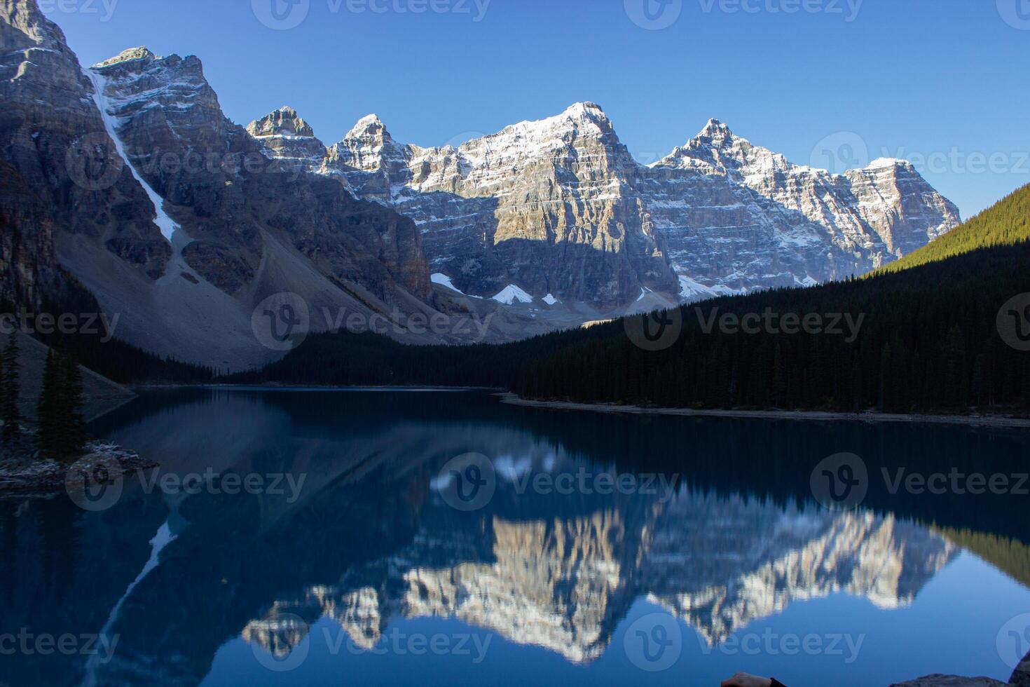 Valley of Ten Peaks near Moraine Lake on a sunny autumn day with snow on the mountain. photo