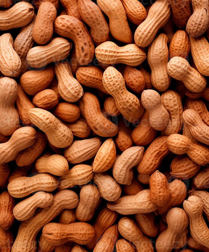 Peanuts heap background, top view, close up texture photo