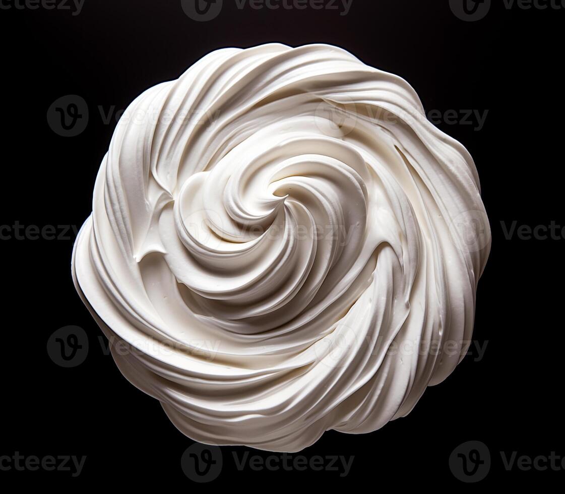 Whipped cream on black background, top view photo