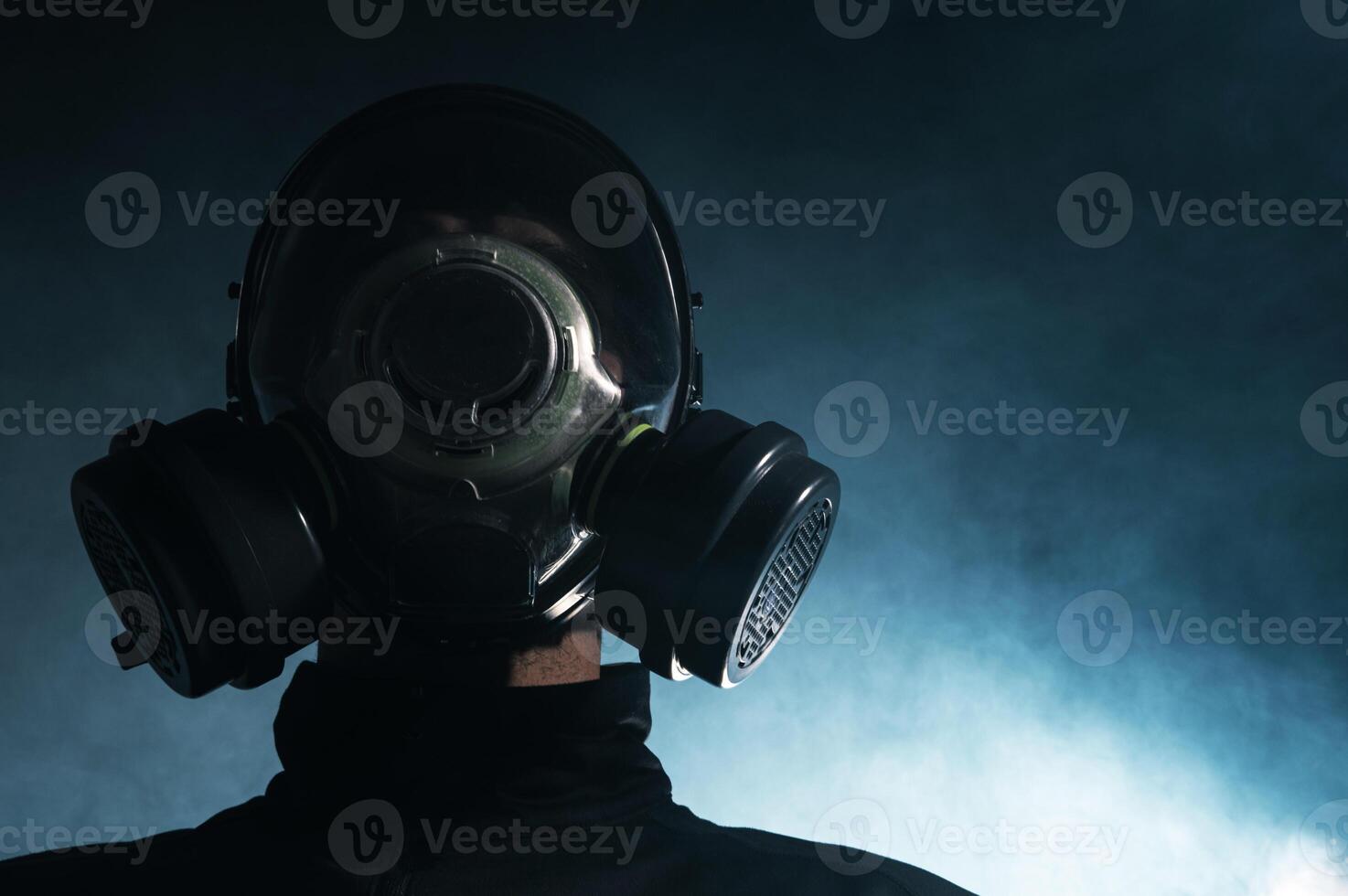 Man in Gas Mask Amidst Smoke photo