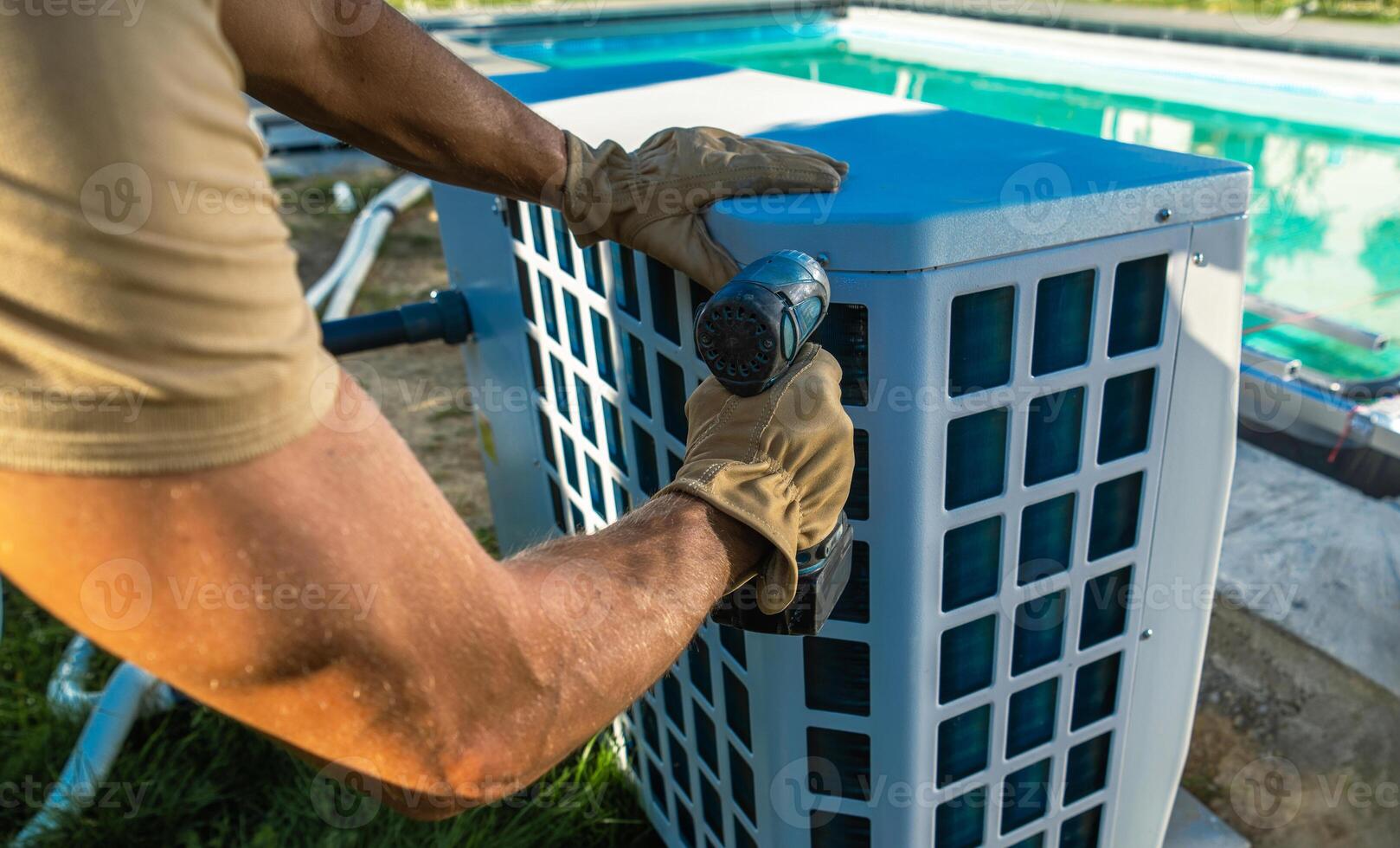 HVAC Technician Installing Pool Heater Near Swimming Pool photo