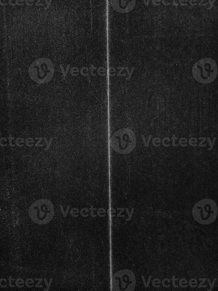 Folded paper with grungy texture in black background. can be used to replicate the aged and worn look for your creative design. old paper for photo texture overlay in retro style