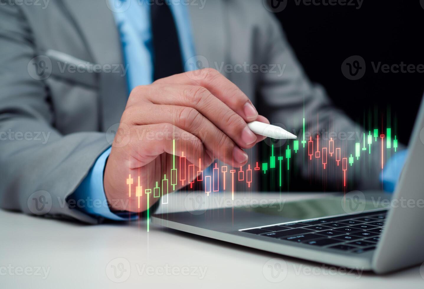 Stock market, Progress or success concept, Business growth, Businessman or trader is showing a growing virtual hologram stock on computer, Planning and strategy, Invest in trading. photo