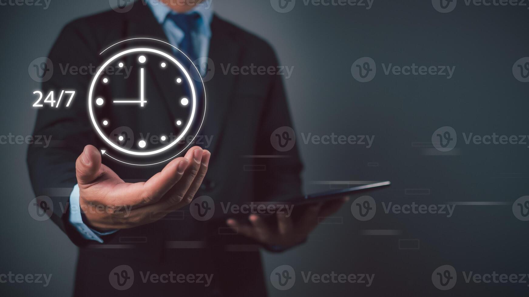 Businessman showing a symbol work 24 hour and 7 day by icon virtual screen hologram, 24 hour open, 24 hour payment online banking, shopping, transaction online service server cloud running. photo