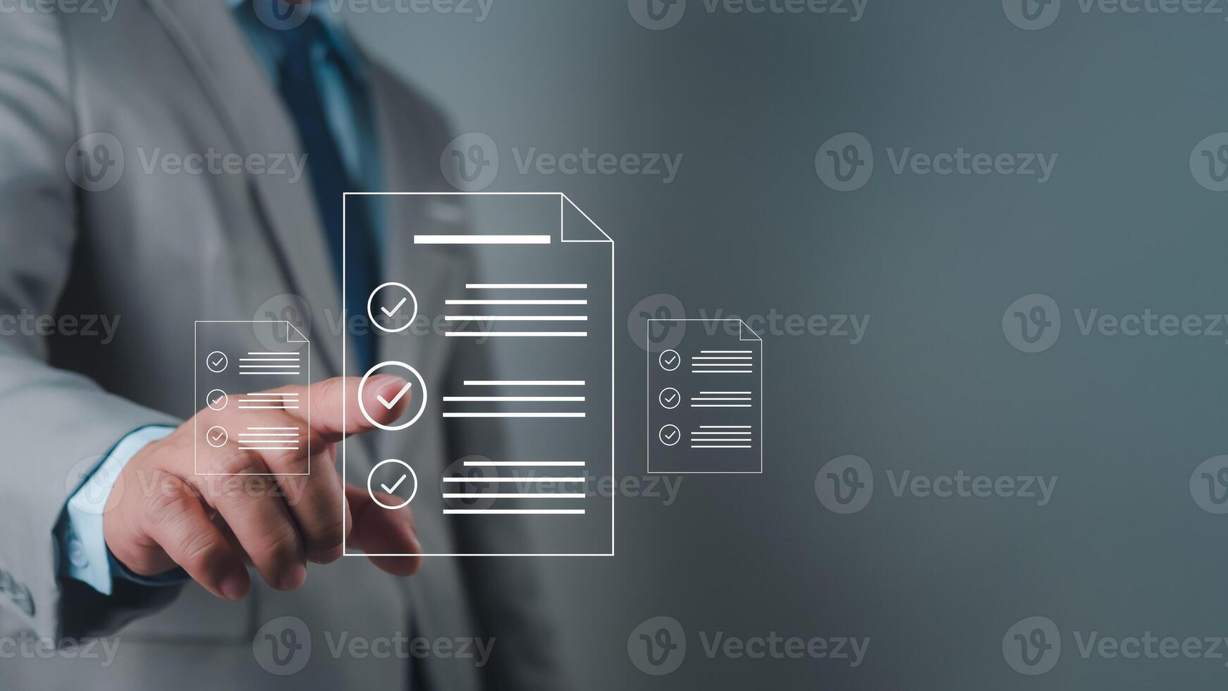 Businessman using hands to check and fill out online survey form DMS document management system, quality control and verification photo