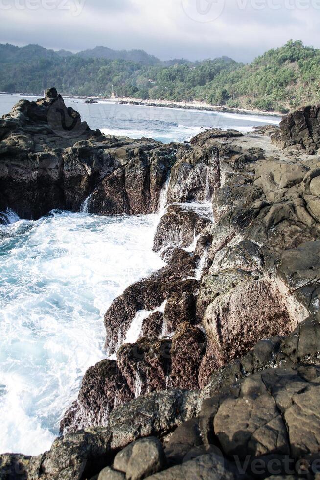 After waves at rocky beach. photo