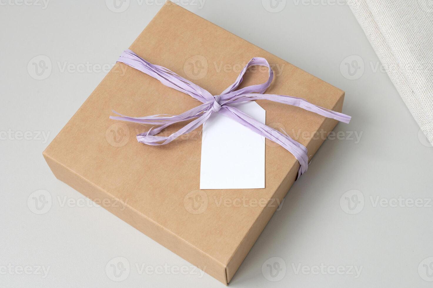 Boxes for parcels made of kraft paper on a gray background. photo