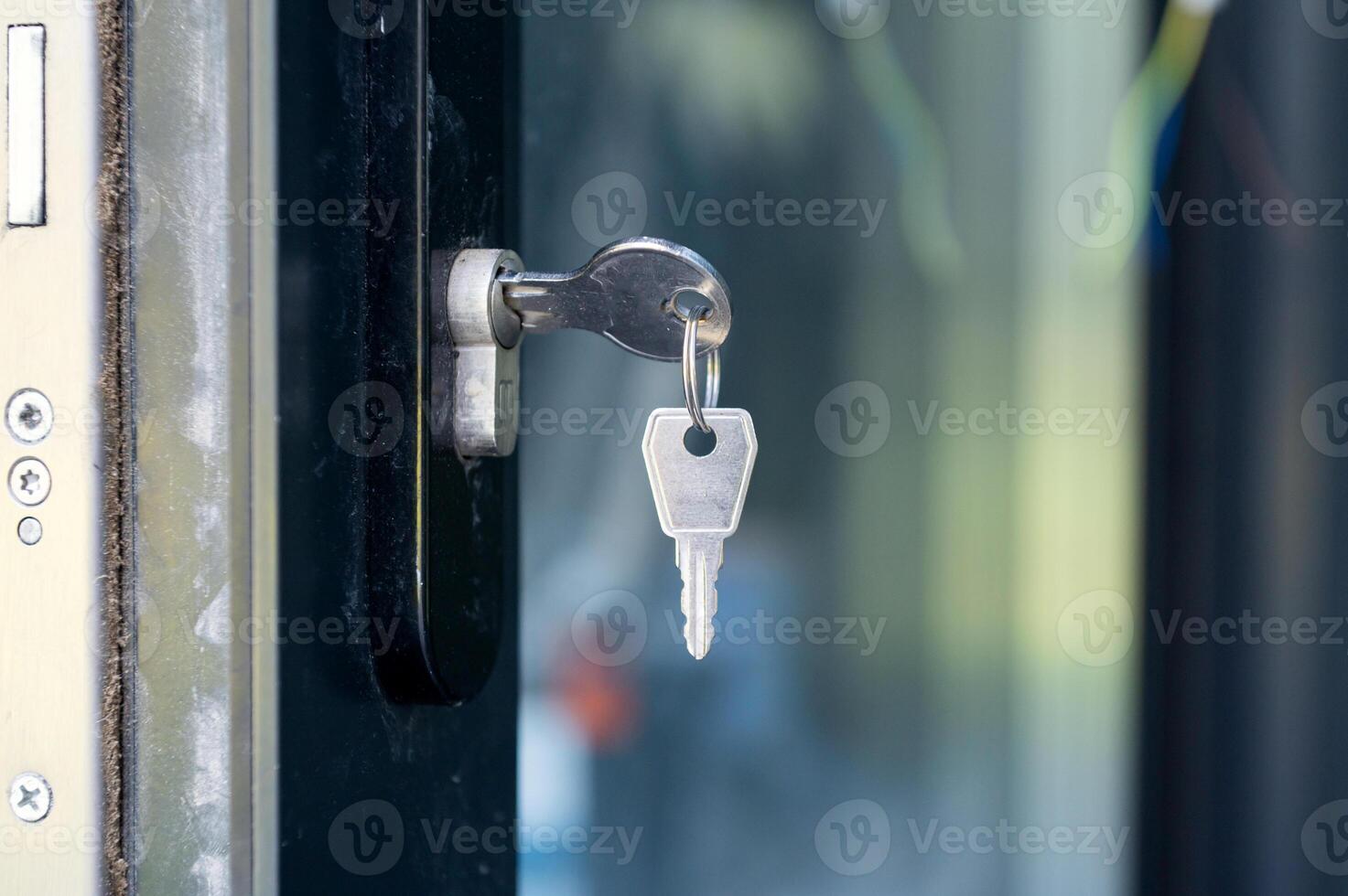 The keys are in the keyhole in the door photo