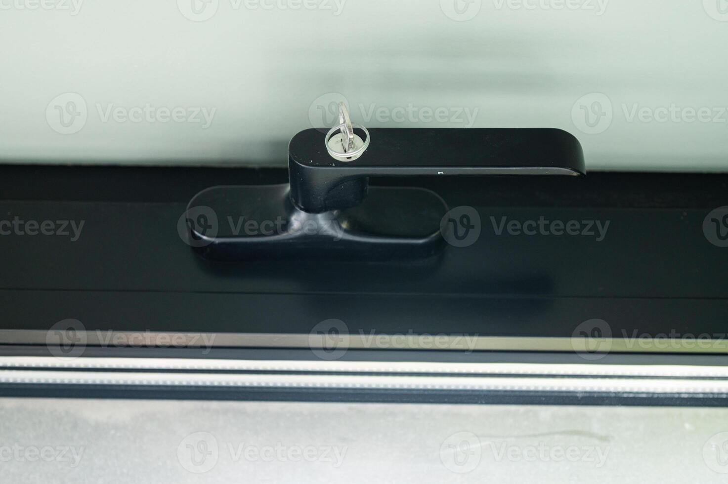Window handle with secure lock with key photo