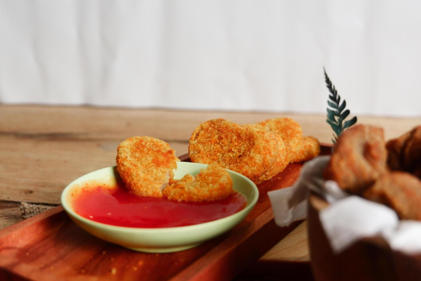 photography of chicken nugget food on a board photo