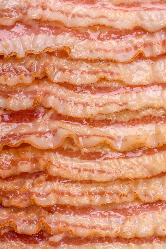 Delicious bacon in the form of slices with salt, spices and herbs photo