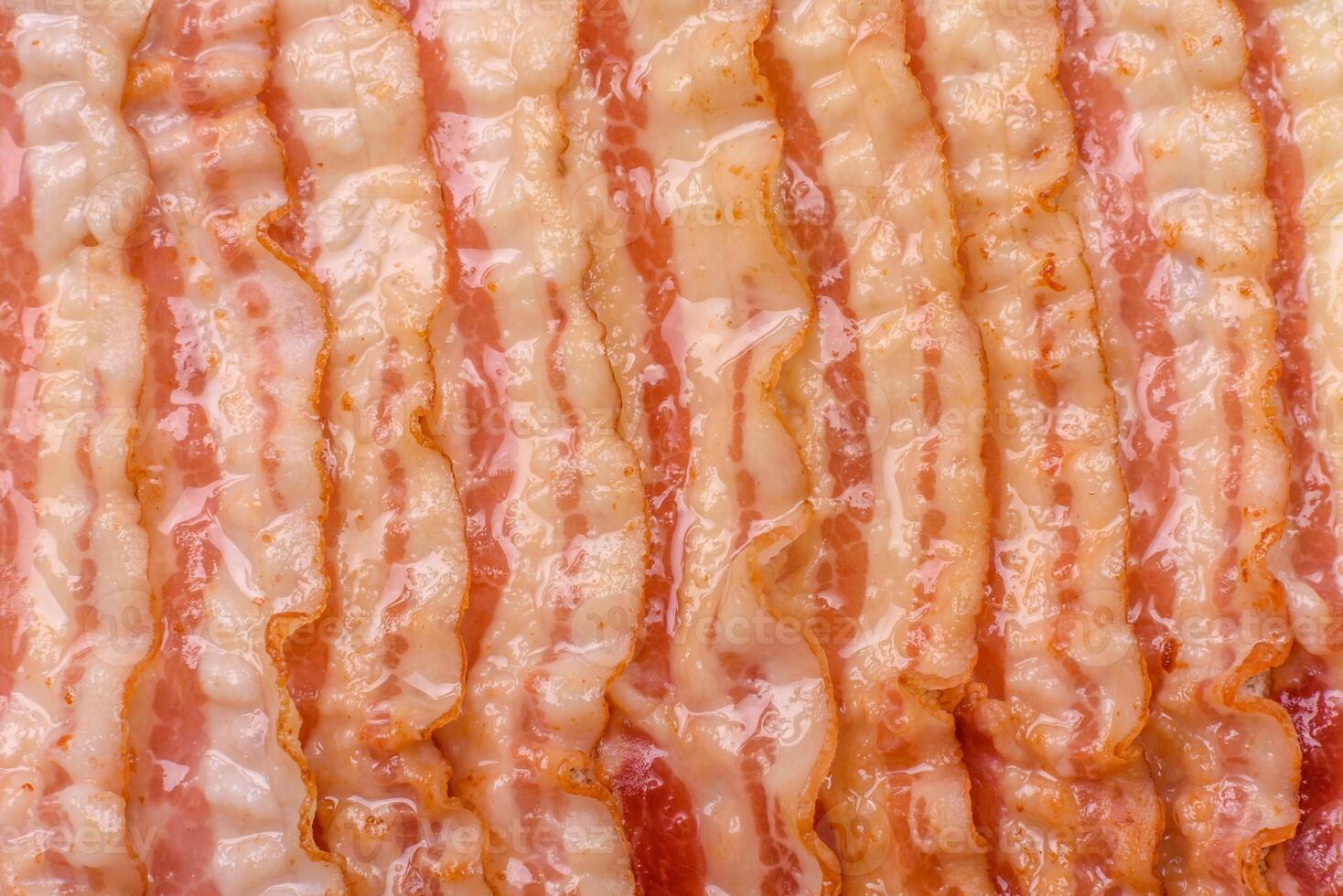 Delicious bacon in the form of slices with salt, spices and herbs photo