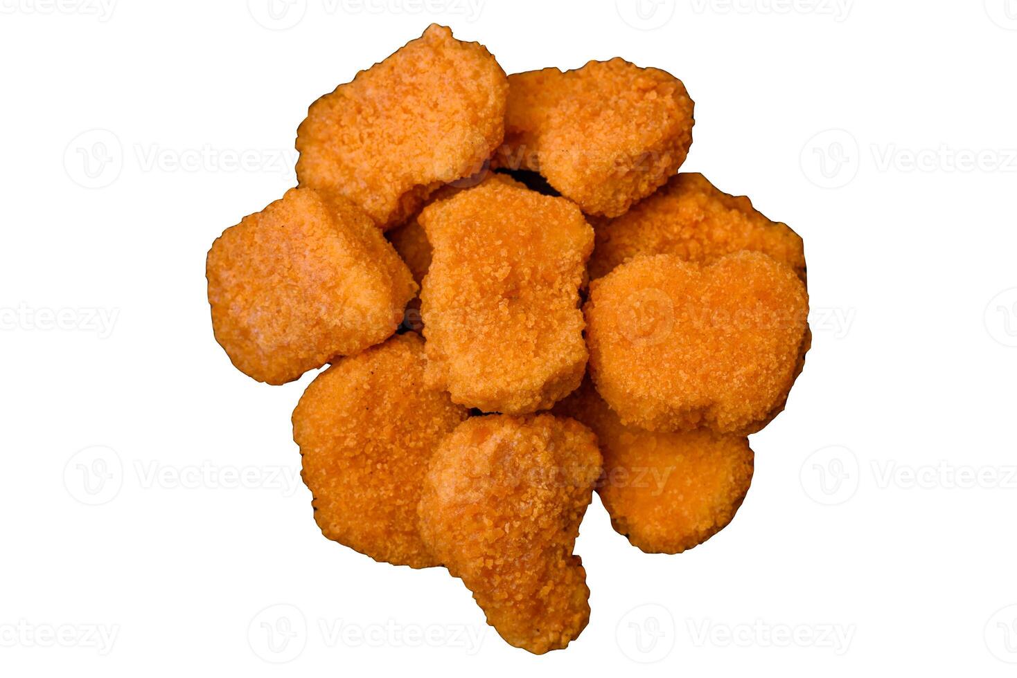 Delicious fresh crispy chicken nuggets on a dark concrete background photo