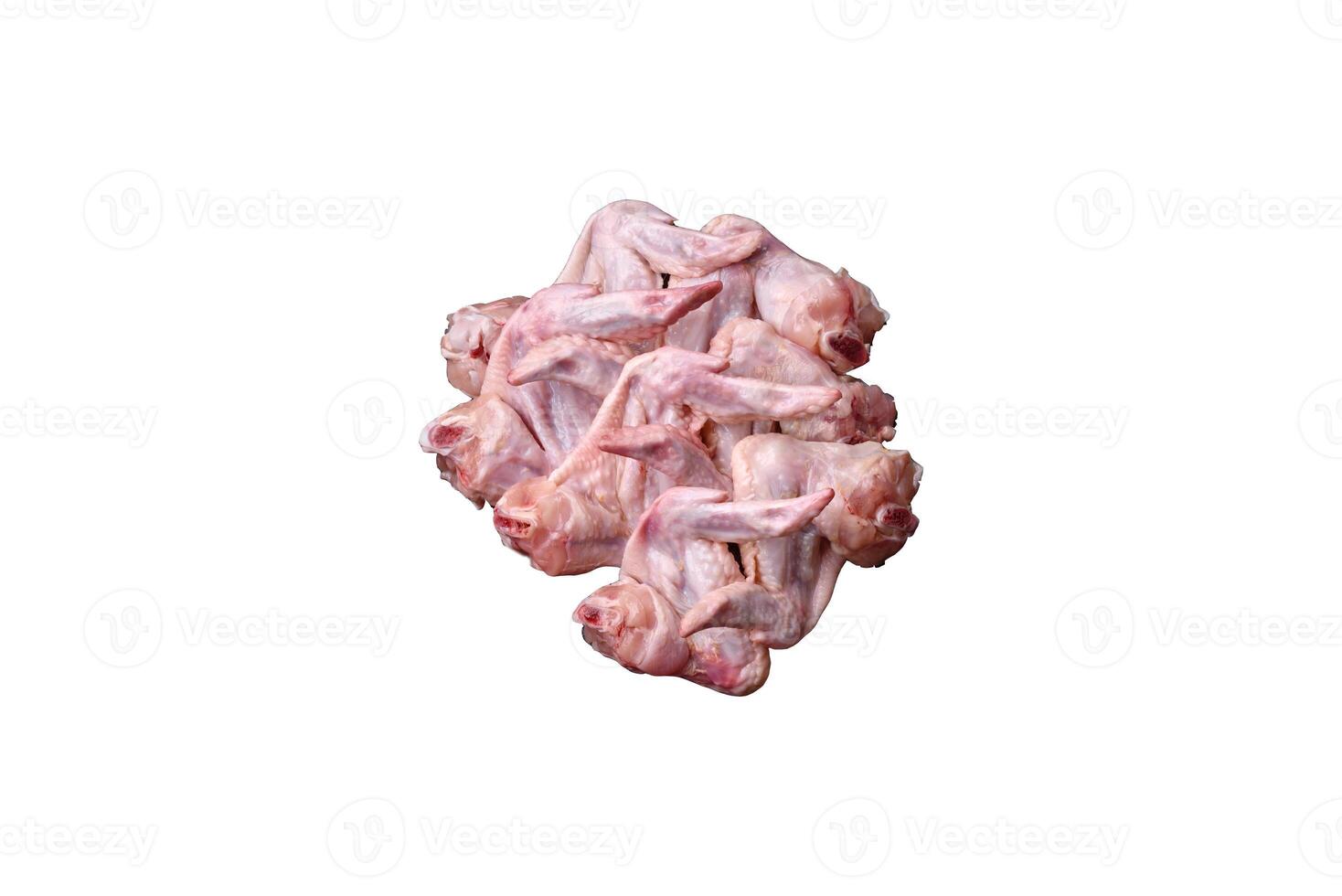 Fresh chicken wings with salt, spices and herbs photo
