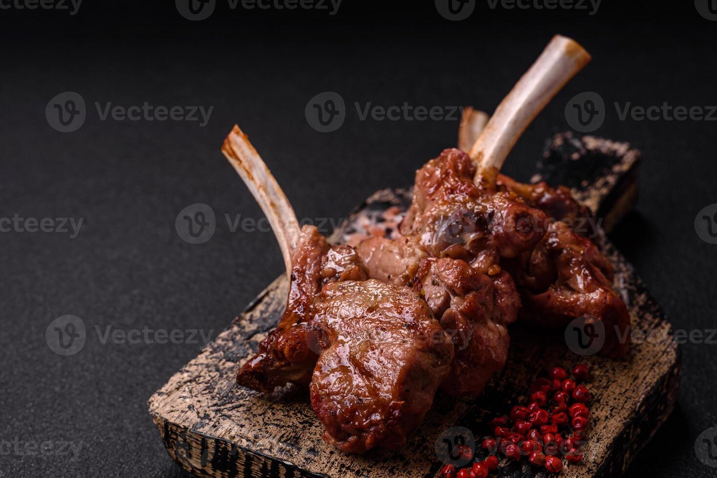 Delicious juicy meat on the bone or rack of lamb or grilled veal photo