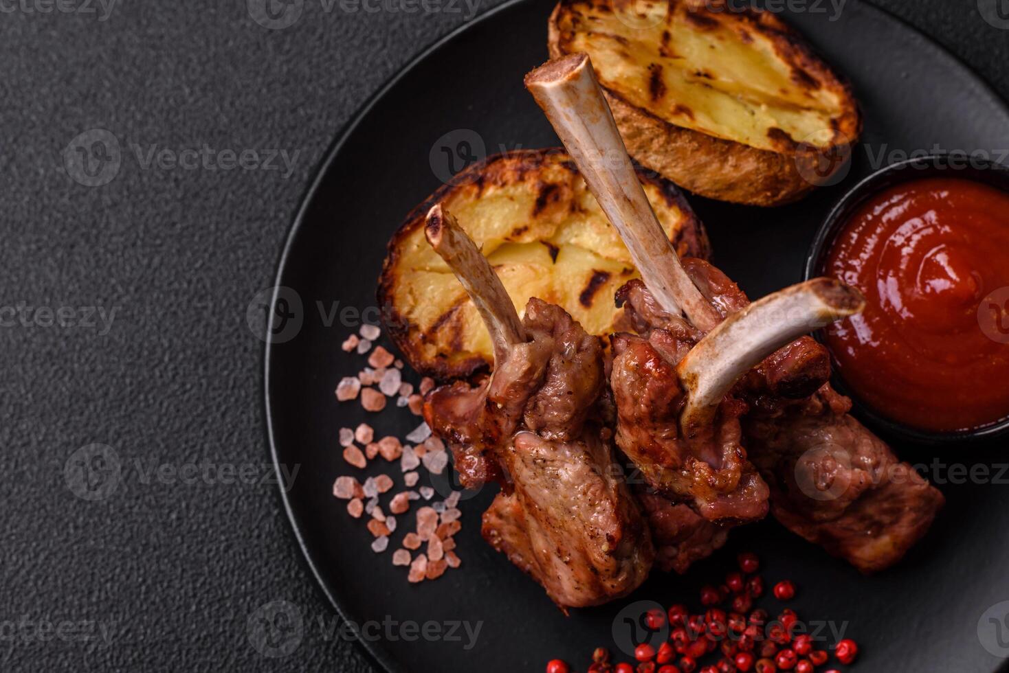 Delicious juicy meat on the bone or rack of lamb or grilled veal photo