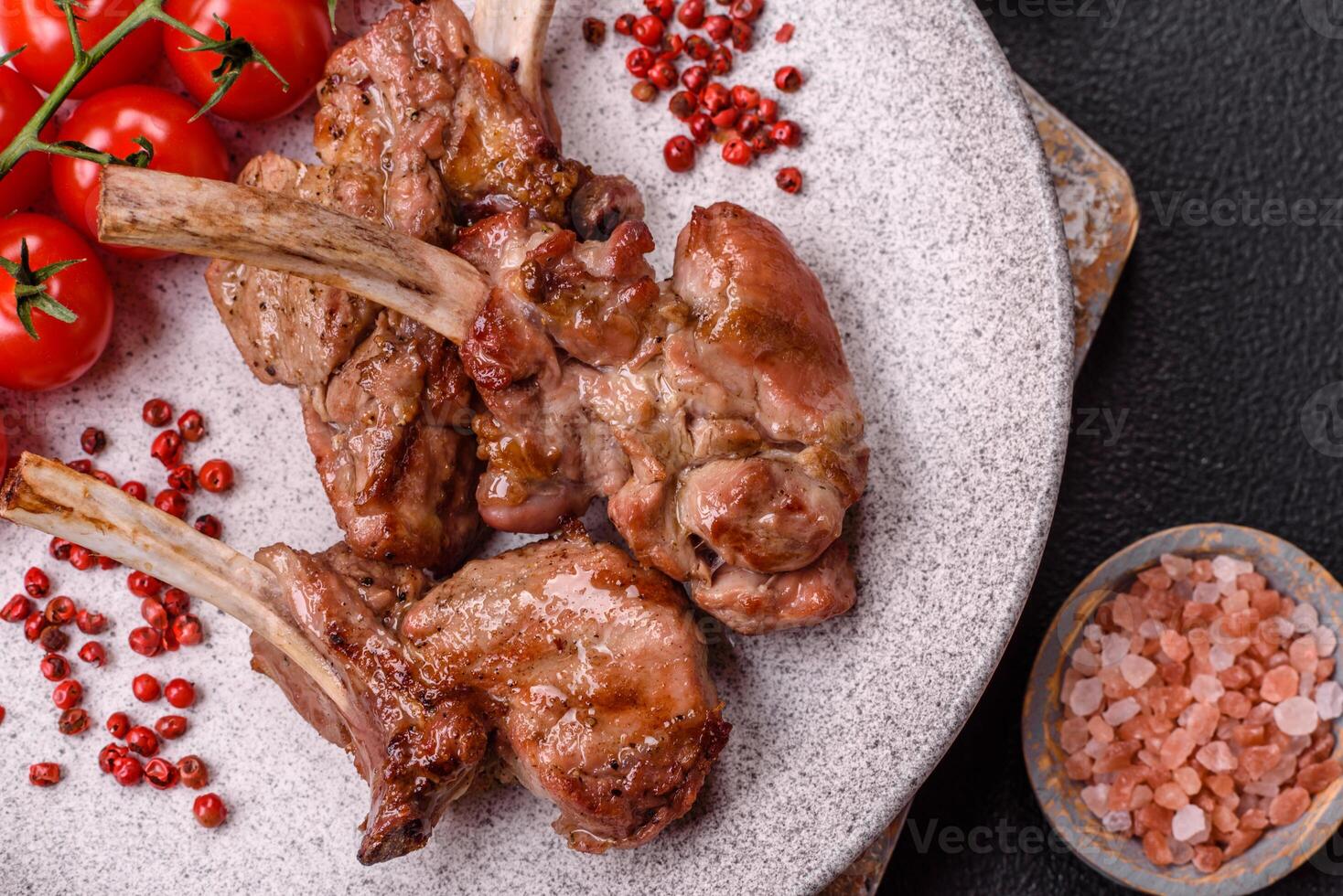 Delicious juicy meat on the bone or rack of lamb or grilled veal photo