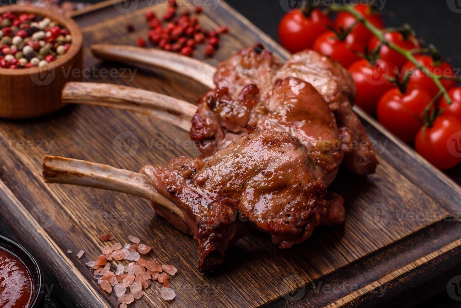 Delicious juicy meat on the bone or rack of lamb or grilled veal photo