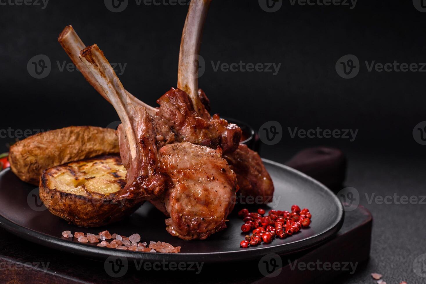 Delicious juicy meat on the bone or rack of lamb or grilled veal photo