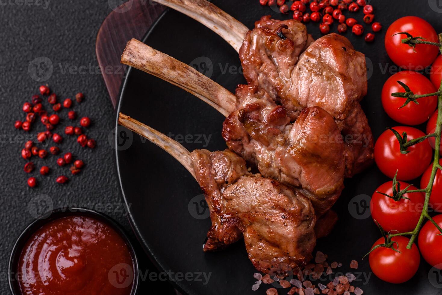 Delicious juicy meat on the bone or rack of lamb or grilled veal photo