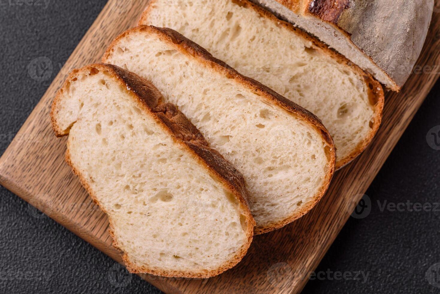 A loaf of brown bread with grains of cereals photo